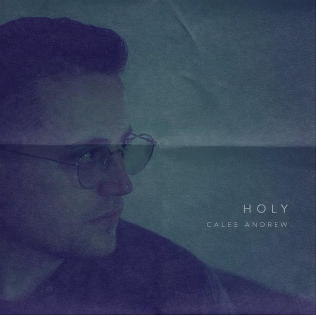 Holy (In the Valley) single cover featuring Caleb Andrew in a muted blue landscape