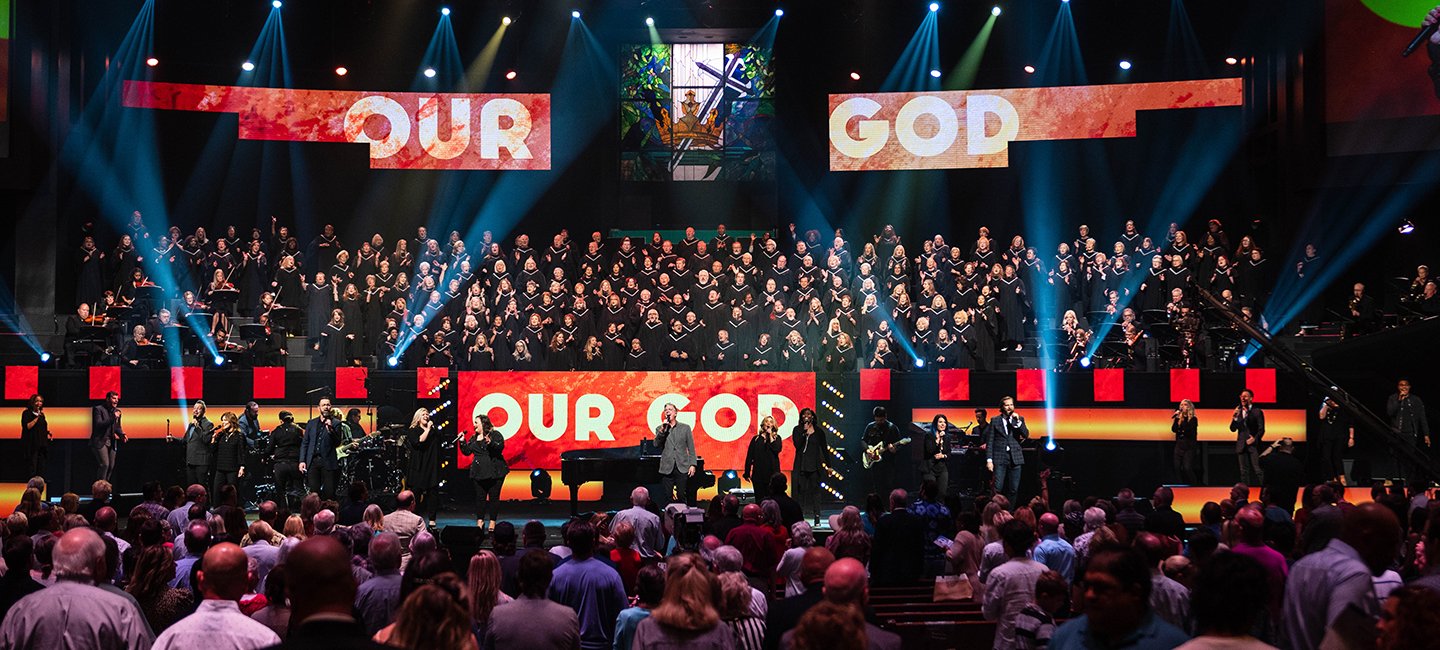 A large Prestonwood choir and singers performing on stage