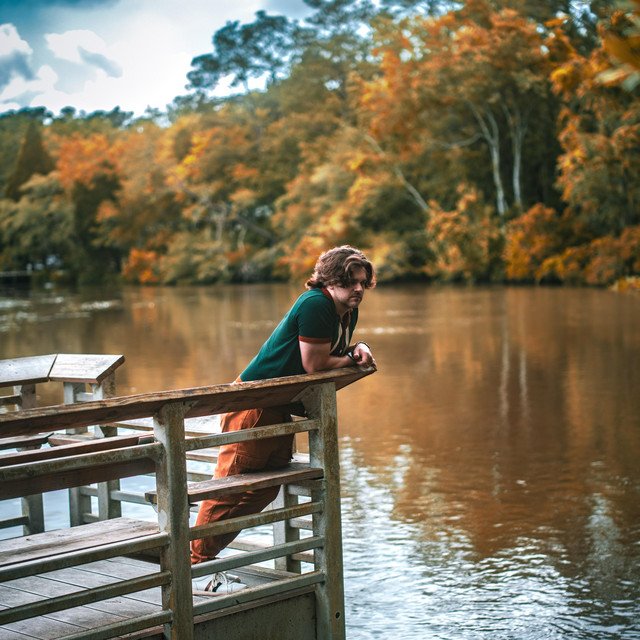 Tyler Philip Ratcliffe standing beside the water